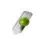 A whole green lime sits on the AdHoc Cut'N Serve Fine Rectangle Grater, displayed against a white background.