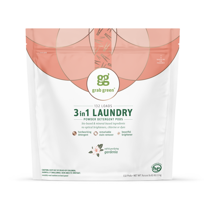 A white pouch of grab green 3 in 1 Laundry Detergent Pods – Gardenia for 132 loads features plant-based ingredients, stain remover action, and has green text with a circular design at the top.