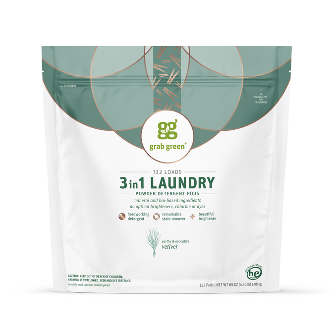 A white and green resealable bag of grab green 3 in 1 Laundry Detergent Pods - Vetiver, highlighting natural ingredients, stain remover power, 132 load capacity, a vetiver scent, and simple graphic design.