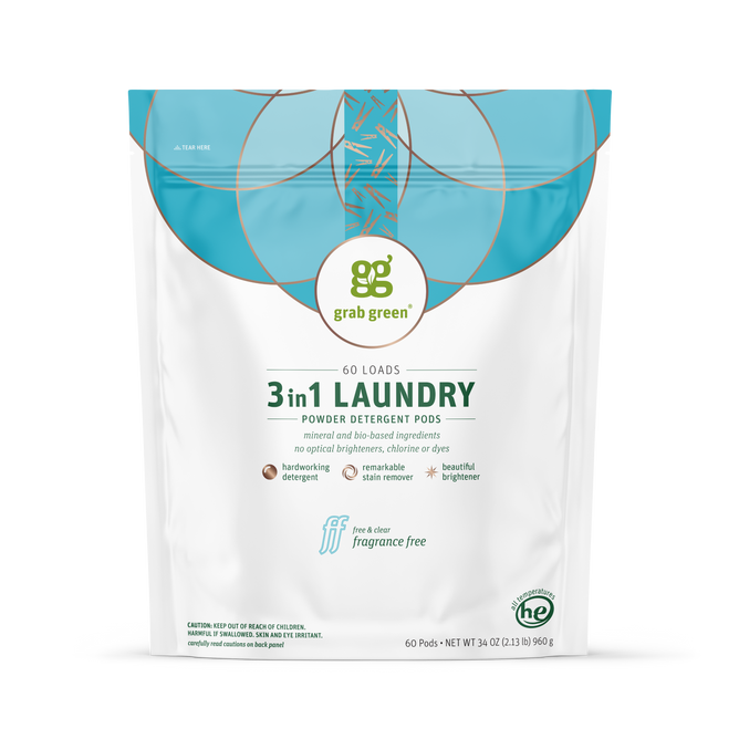 A white and blue bag of grab green 3 in 1 Laundry Detergent Pods - Fragrance Free sits upright, featuring 60 loads, strong stain removal, no harsh chemicals, and is suitable for high-efficiency machines.