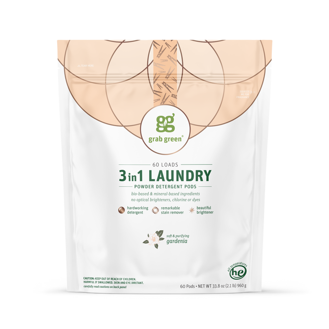 A white bag of grab green 3 in 1 Laundry Detergent Pods - Gardenia features 60 loads, natural ingredients, and symbols for stain remover power, brightening, and no harsh chemicals.