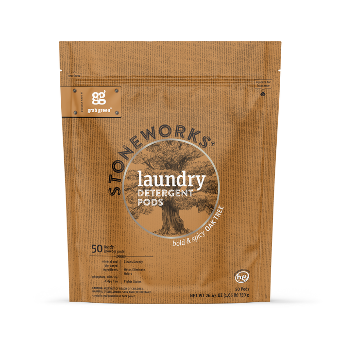 A brown resealable pouch of grab green Stoneworks Laundry Detergent Pods – Oak Tree scent, with 50 pods, stain-fighting and odor-neutralizing power, eco-friendly packaging, and an illustrated tree.