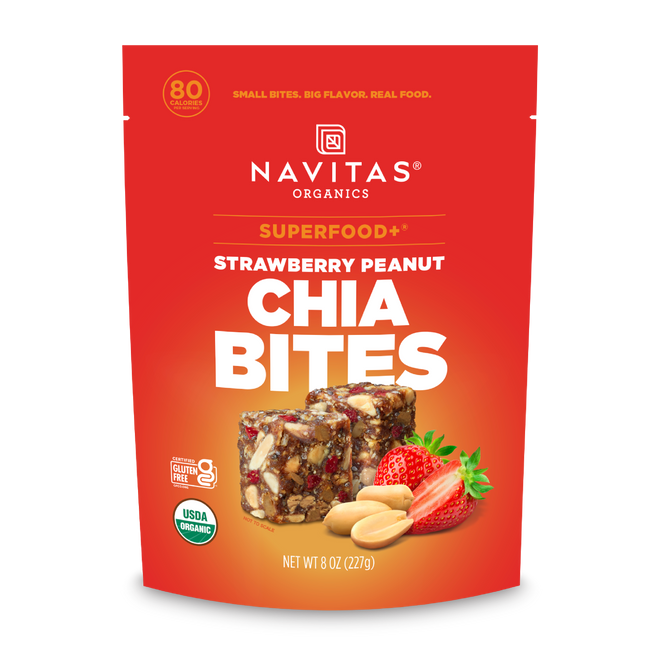 A red pouch of Navitas Organics Superfood+ Strawberry Peanut Chia BITES, featuring images of strawberry, peanut, and chia bites on the front, with product details and nutritional highlights for these superfood snacks.