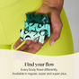 A hand holds three teal-wrapped Cora pads against yellow ribbed leggings. Text below reads, Find your flow. Every body flows differently. Explore Cora’s range of period care, including regular, super, and super plus pads—as well as Applicator Free Tampons made with 100% organic cotton for all your period needs.