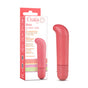 The Blush Gaia Eco G-Spot Vibrator in pink stands upright next to its box, which displays the brand name, product details, and highlights its eco-friendly features.