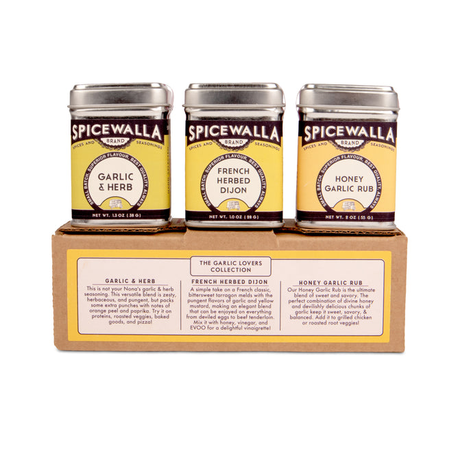 The Spicewalla Garlic Lovers 3 Pack Collection features Garlic & Herb, French Herbed Dijon, and Honey Garlic Rub seasonings in a brown holder—an ideal garlic trio for any kitchen.