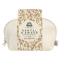The Self Care Spa Set - Santal & Amber by Pacha Soap Co. includes soap, body wash, bath bomb, and candle in a cream-colored quilted pouch with a floral tag. Enjoy a woodsy scent for the perfect self-care gift set.