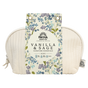 A cream quilted pouch with a floral tag labeled Self Care Spa Set - Vanilla & Sage by Pacha Soap Co. features soothing blue, green, and purple blooms and includes a soap, bath bomb, and candle.