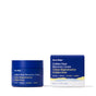 A blue jar of Ursa Major Golden Hour Recovery Cream sits on the left, next to its matching blue box on the right, both displayed against a white background. This facial moisturizer is known for providing deep hydration.