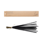 A bundle of black Incense Sticks from P.F. Candle Co., tied with twine, is positioned beneath a brown rectangular box on a white background, evoking signature scents with rich sandalwood notes.