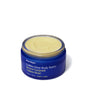 A blue jar of Ursa Major Golden Hour Body Butter with an open lid shows creamy yellow butter inside. Ideal for deep hydration and supporting the skin barrier. The label features both English and French text.