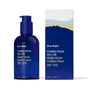 A dark blue pump bottle and box labeled Ursa Major Golden Hour Dry Oil, featuring abstract mountain art in blue, yellow, and white—this dry-finish oil helps replenish skin and hair while locking in moisture.