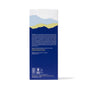The back of the Ursa Major Golden Hour Dry Oil box displays a blue and yellow mountain landscape at the top, with white text below on dark blue describing how this dry-finish oil locks in moisture and replenishes skin and hair.
