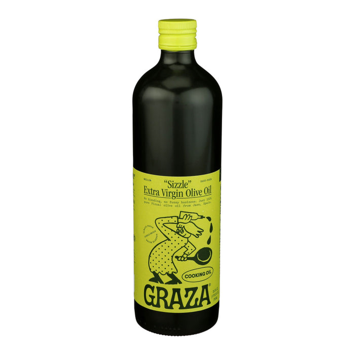 A dark green bottle of Graza Sizzle Glass Extra Virgin Olive Oil with a bright yellow label featuring a cartoon pouring oil, the words “Cooking Oil,” and mellow flavor made from high-quality olives.