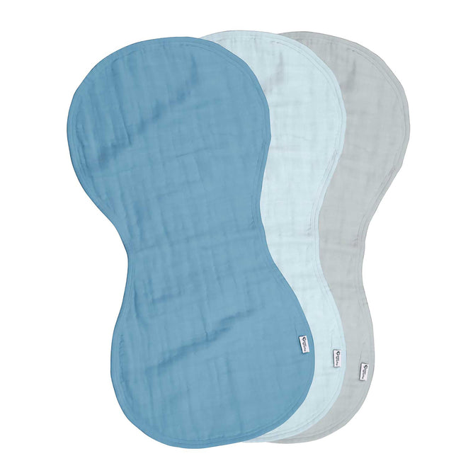 Three Green Sprouts hypoallergenic burp cloths, in dark blue, light blue, and gray, are arranged with a charming overlap. Made from 100% Certified Organic Cotton Muslin, they feature a peanut-shaped design and textured surface.