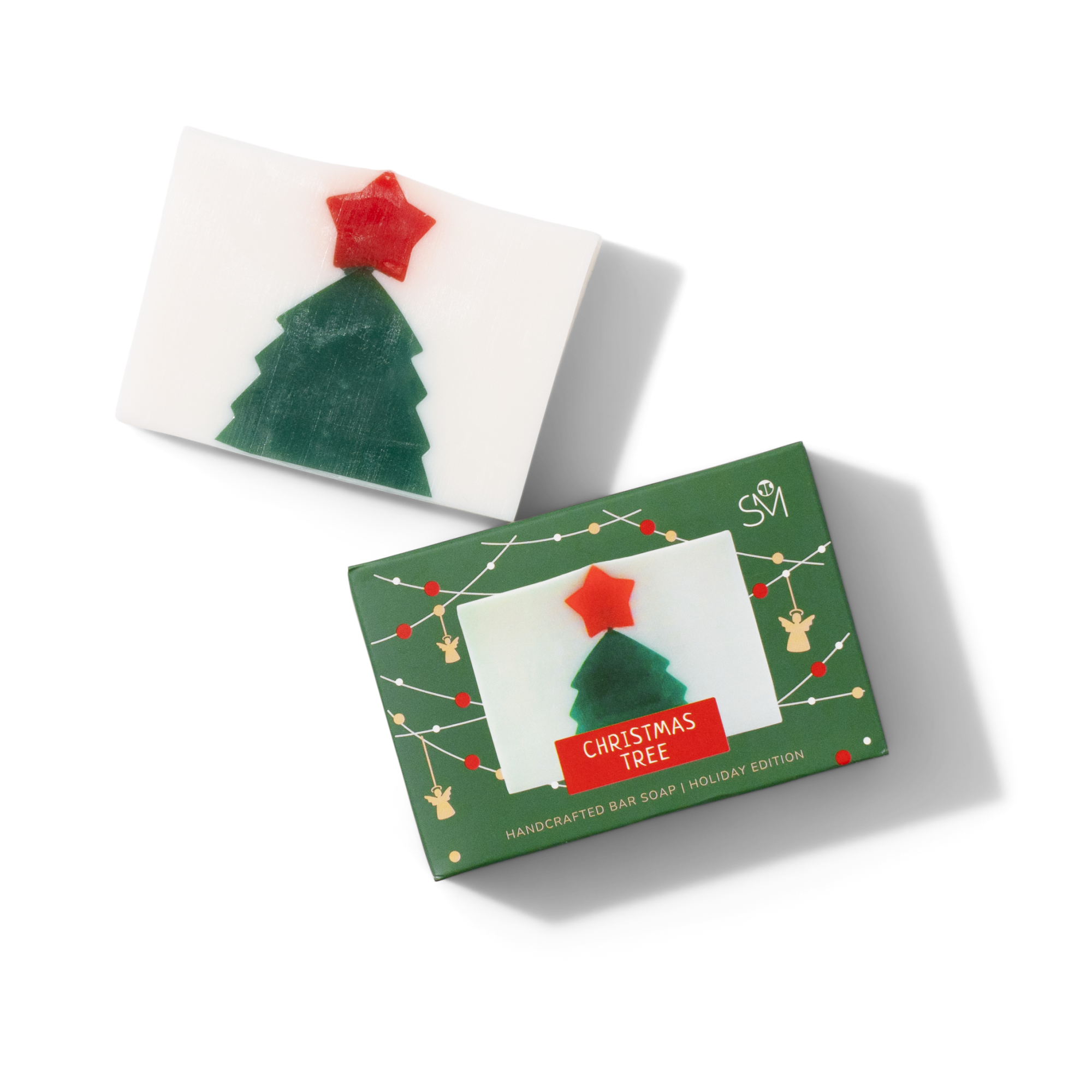 A rectangular bar of soap with a green Christmas tree and a red star design, shown next to its festive green box labeled Christmas Tree Handcrafted Bar Soap / Holiday Edition.
