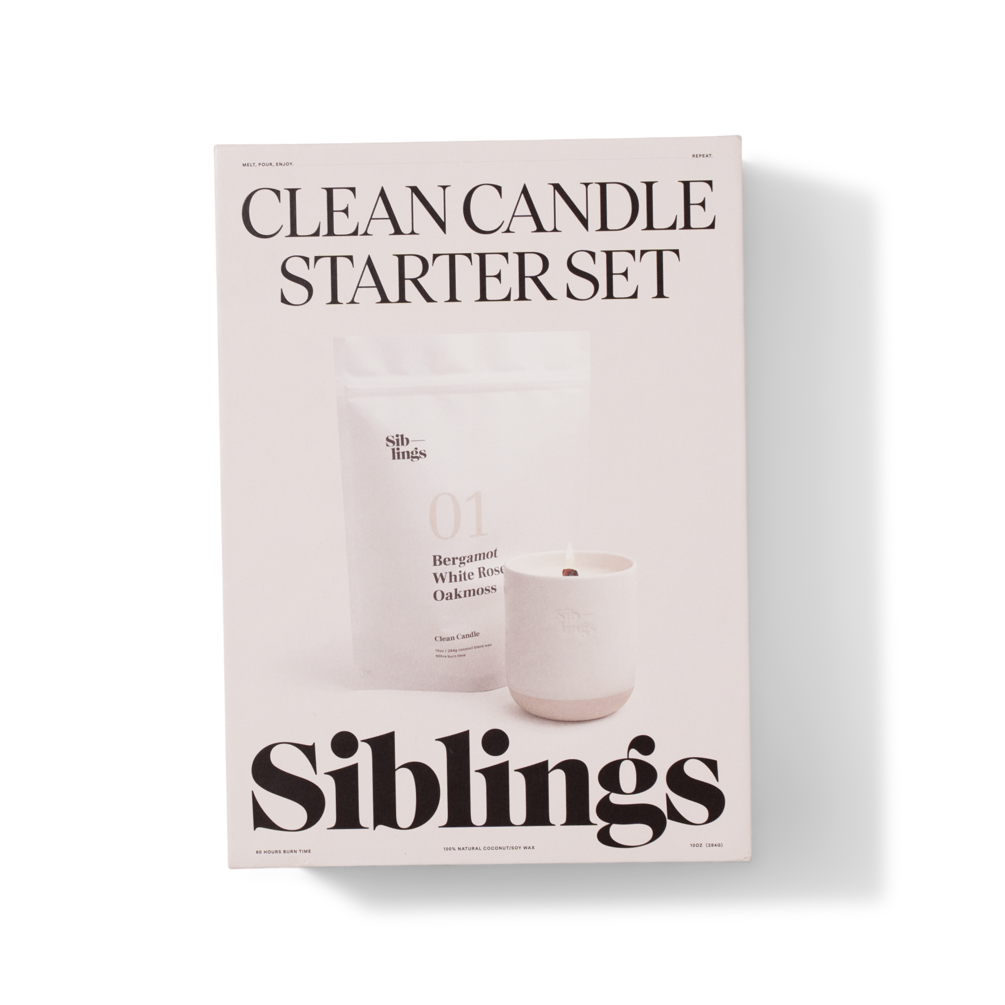 A box labeled Clean Candle Starter Set by Siblings, showing a white candle in a cup and a packet labeled 01 Bergamot White Rose Oakmoss. The packaging is minimalist with large black text on a white background.