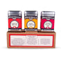 Three Spicewalla Grill & Roast Collection 3 Pack tins—Carolina BBQ, Honey & Herb, and Cowboy Grilling—are shown on a box with printed descriptions, ideal for grilling and roasting seasonings.
