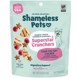 A teal 2.5 oz pouch of Shameless Pets Cran You Say Chicken Cat Treats features chicken and cranberry images, a cartoon cat, and text about digestive support, probiotics, and antioxidants.