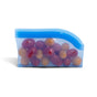 The Grove Co. Reusable Silicone Bag, shown in blue and filled with assorted red and green grapes, provides leak-proof, sustainable snack storage against a clean white background.