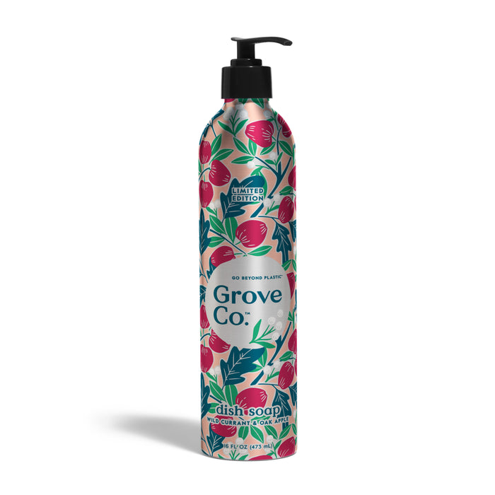 A tall, floral-patterned Grove Co. metal bottle with black pump dispenses Fall Collection Dish Soap Refill, scented red currant and goji (16 fl oz). Label features pink and green fruit illustrations.