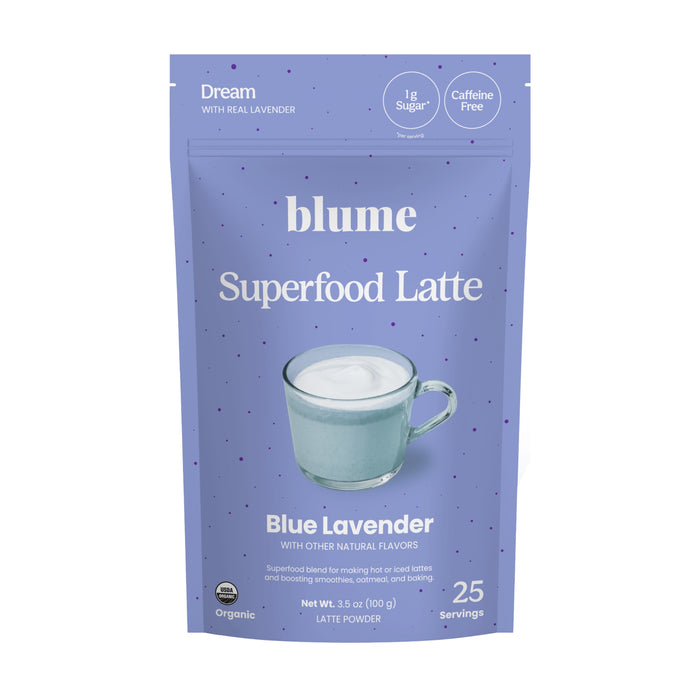 A light purple pouch labeled blume Organic Blue Lavender Latte Powder features a mug of frothy latte. This organic, caffeine-free blend provides 25 servings of a calming bedtime drink.