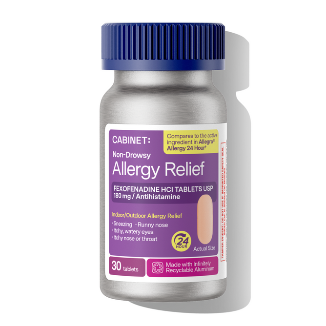 A bottle of Cabinet Health Allergy Relief Tablets - Fexofenadine HCl 180mg contains 30 non-drowsy tablets that provide 24-hour relief from both indoor and outdoor allergies. The medicine comes in a container with a purple cap and a purple label.