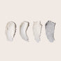 Four smears of The Holiday Bonbon by Everist—creams in varied textures and shades of white and gray—are arranged side by side on a light neutral background.