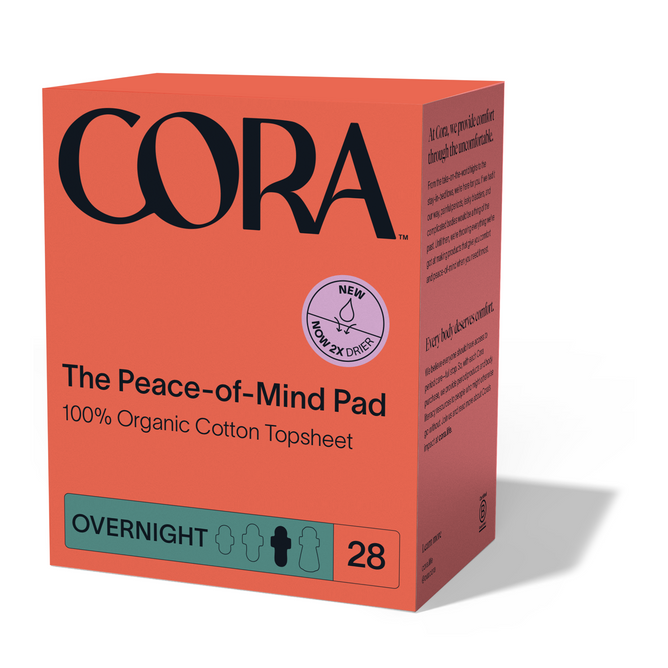 The Cora Peace of Mind Pad, in an orange box labeled OVERNIGHT, contains 28 pads with a 100% organic cotton topsheet. A New Now 2x Drier badge appears on the packaging alongside visible product details.