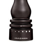 Close-up of the base of a Cole & Mason Wood Pepper Grinder with Carbon Steel Grinding Mechanism shows grind select settings marked by white dots, a triangle indicator, and Cole & Mason branding printed at the bottom.