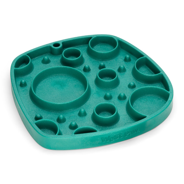 The West Paw Seaflex Bubbles Feast Mat is a green, square silicone slow feeder and lick mat with round indents, designed to provide pets with mental stimulation during mealtime.
