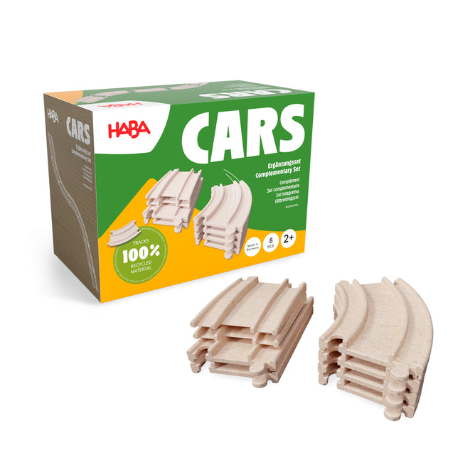 A HABA Cars Expansion Set made from 100% recycled materials is shown with curved wooden tracks in front. The green and yellow box highlights this eco-friendly toy, perfect for building toddler race tracks for ages 2 and up.