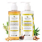 Two bottles of Tree To Tub Thickening Collagen and Biotin Shampoo & Conditioner Starter Set for fine, flat hair, displayed with lemons, tea tree leaves, argan and macadamia nuts—your biotin duo for fuller-looking hair.