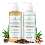 Two pump bottles of Tree To Tub Volumizing Caffeine & Biotin Shampoo and Conditioner for Fuller, Thicker Hair, with green and blue labels, set among eucalyptus leaves, coffee beans, and aloe vera.