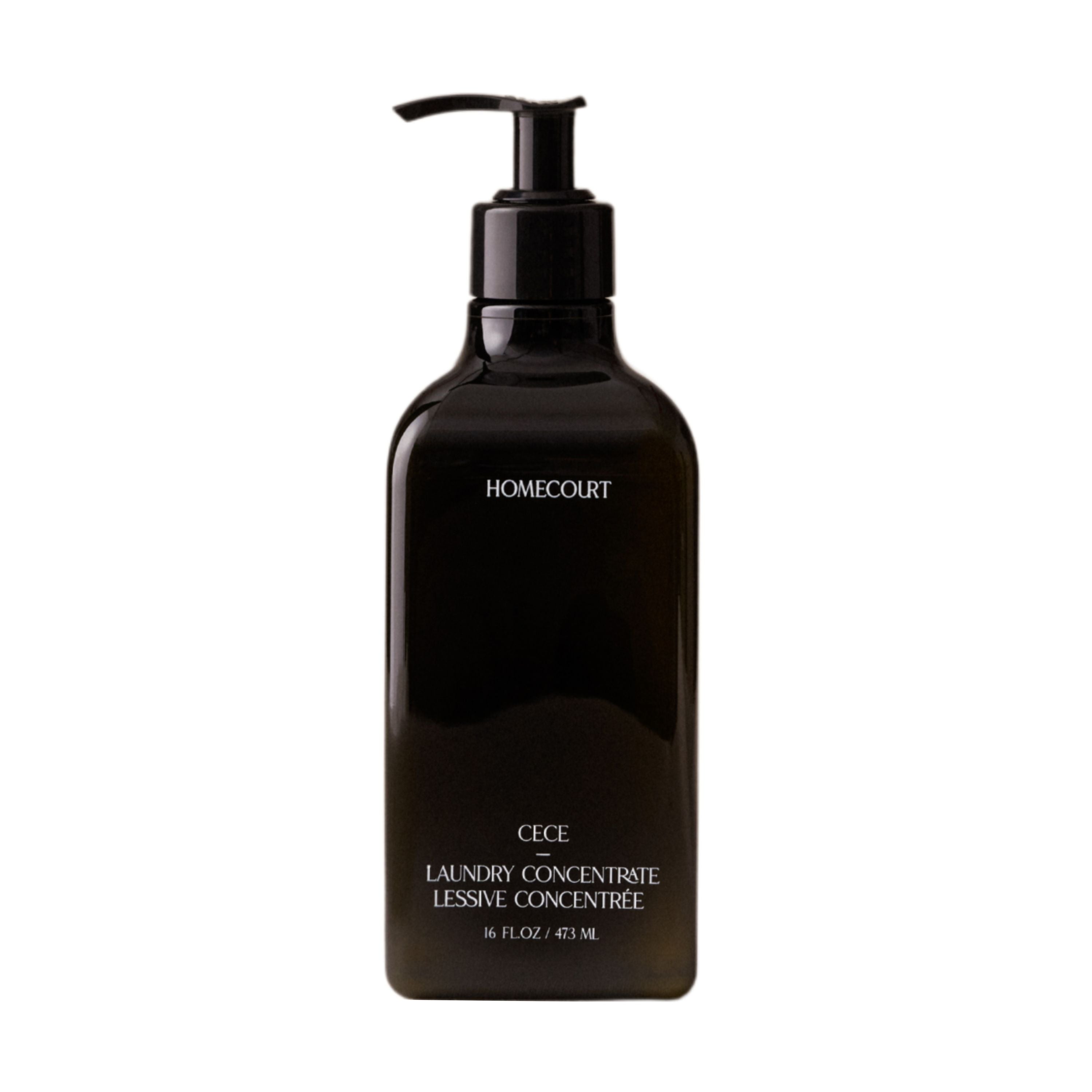 A black Homecourt Laundry Concentrate pump bottle, 16 fl oz (473 mL), with eco-friendly plant-based cleaning agents, shown against a white background.