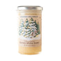 A 12oz (340g) glass jar of Savannah Bee Company Winter White Whipped Honey with a snow-covered pine tree label, containing pure wildflower honey known for its creamy texture and delicate flavor.