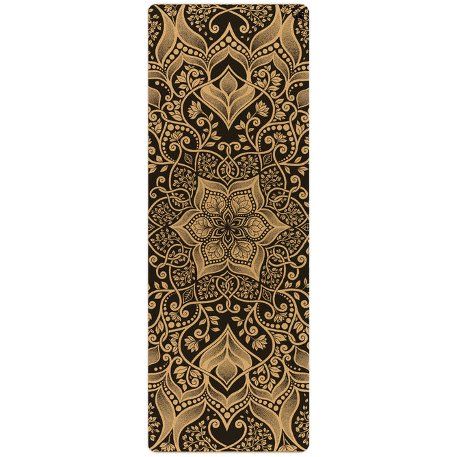 The Harmony Aura Cork Yoga Mat by Yoloha Yoga is a cushioned yoga mat featuring an ornate gold mandala and floral pattern on a black background, showcasing intricate, symmetrical designs and detailed eco-friendly plant foam construction.