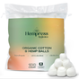 A semi-transparent bag labeled Hempress Hygienics Hemp & Cotton Balls contains 100 sustainable cotton balls, with several hemp fiber cotton balls displayed in front of the package.