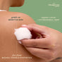 A hand holds a Hempress Hygienics Hemp & Cotton Ball against someone’s shoulder, with text noting that it is gentle on sensitive skin and crafted from organic cotton blended with antimicrobial hemp fiber. These sustainable Hemp & Cotton Balls are completely free from bleach, toxins, and synthetic materials.
