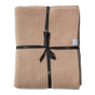 Tan, temperature-regulating Adult Popcorn Blanket - Henna waffle-knit blanket folded and tied with a black ribbon.