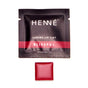 A packet labeled Henné Organics Luxury Lip Tint - Sample, featuring a hydrating organic lip tint, is shown with a small square of red color below it on a white background.
