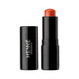 A black tube of Henne Organics Luxury Lip Tint with the cap off reveals a reddish-orange, hydrating lip color. The upright cap sits next to the base, which displays the Henne Organics brand name in white letters.