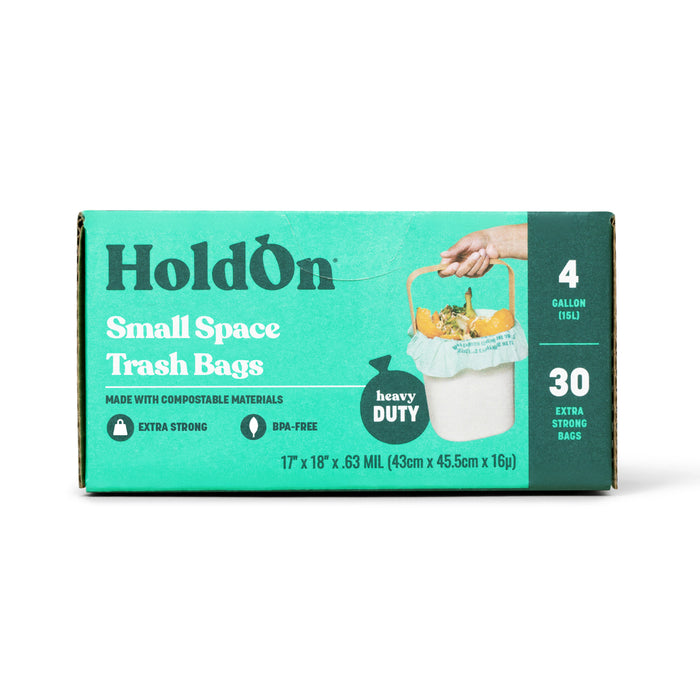 A box of HoldOn Bags Compostable Small Space Bags, 4 gal - Unscented, includes 30 extra strong, BPA-free kitchen bags made from compostable materials. The teal box shows a hand holding a filled trash bag.