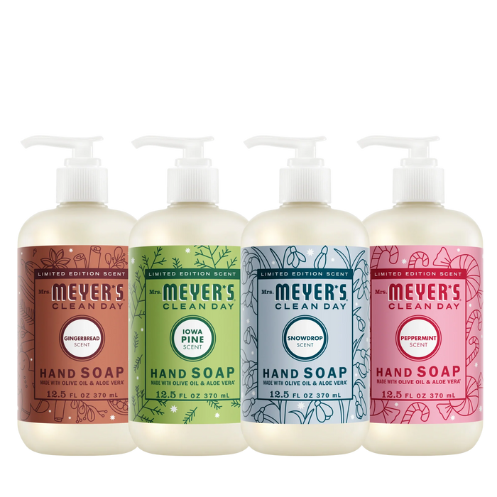 Four bottles from the Mrs. Meyer’s Holiday Hand Soap Collection in gingerbread, pine, snowdrop, and peppermint scents.