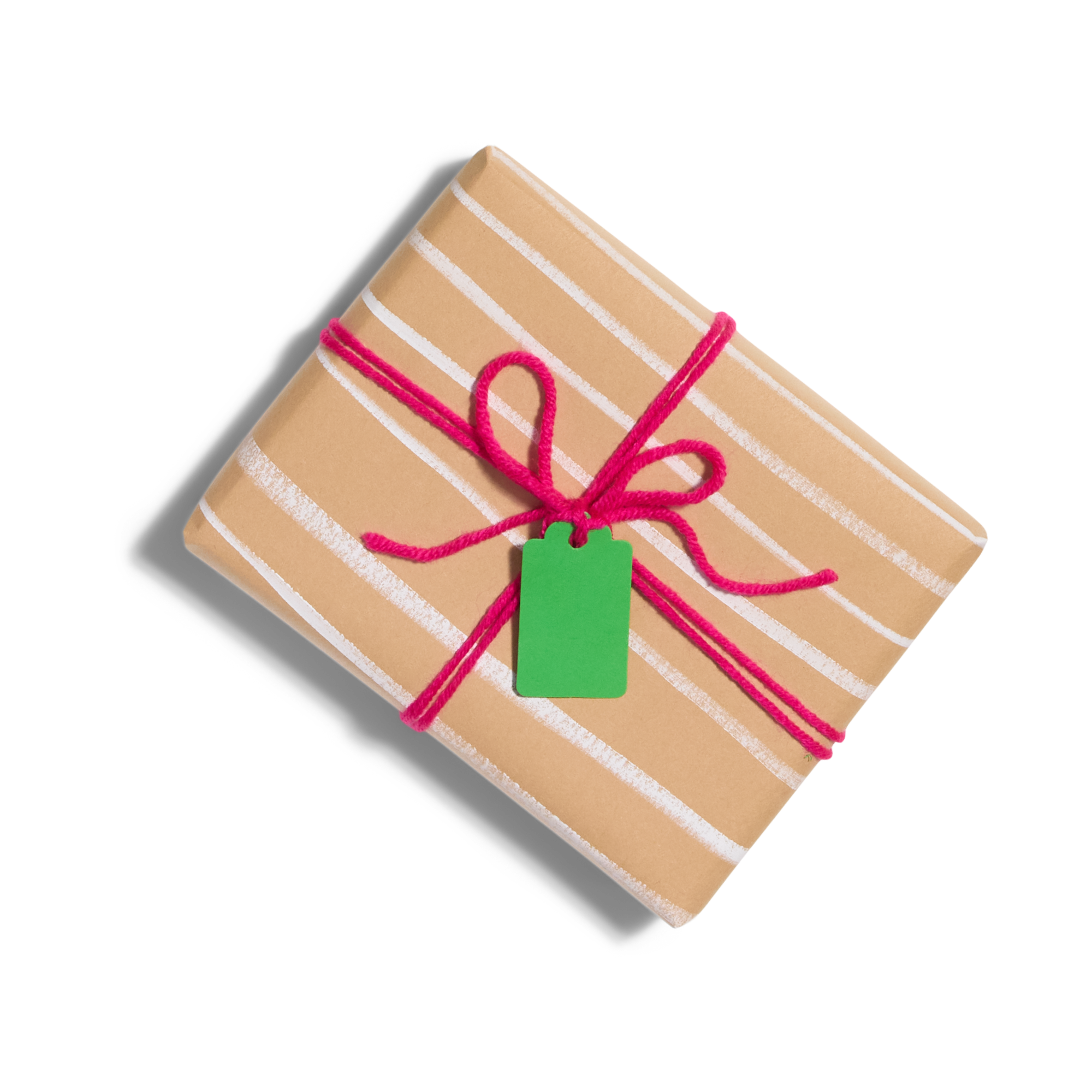 A rectangular gift wrapped in brown paper with white stripes, tied with a bright pink string in a bow, and a green gift tag attached, on a white background.