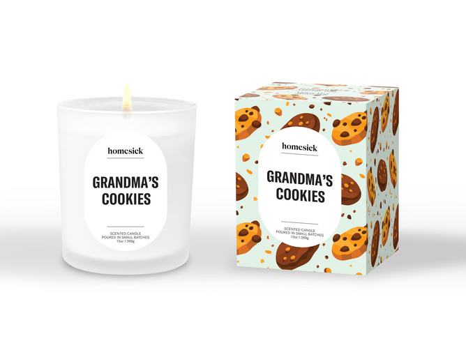 A white soy wax Grandma's Cookies Candle by Homesick sits next to its colorful box, both featuring chocolate chip cookies. The cruelty-free candle and packaging highlight the Homesick brand.