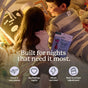 Two young children read a book together in a cozy indoor tent, with a box of Plant People Wonder Sleep Kids Super Sleep Gummies nearby. These gentle, melatonin-free gummies are specially formulated for kids to support restful nights—perfect for travel, big feelings, high energy days, and adjusting to back-to-school routines.