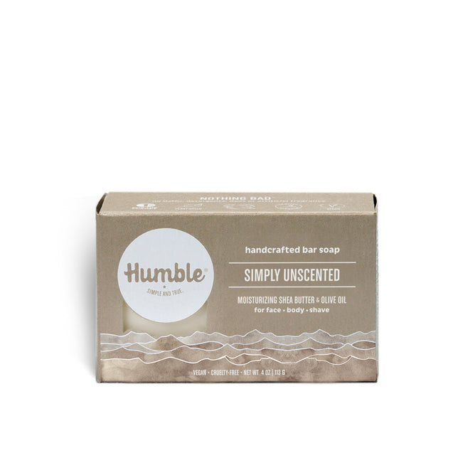 A rectangular box of Humble Brands Bar Soap, labeled Simply Unscented, features moisturizing shea butter and natural oils. Suitable for face, body, and shaving, its eco-friendly beige and white packaging highlights gentle care.