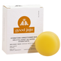 A yellow Hydrating Conditioner Bar by Good Juju Body & Home is displayed before a white box for dry/curly hair, featuring frizz control and organic ingredients with sweet orange and bergamot.