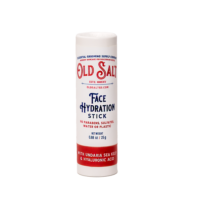 A white tube labeled Old Salt Daily Hydration Stick with Undaria Sea Kelp + Hyaluronic stands upright. The packaging highlights its paraben-, sulfate-, water-, and plastic-free formula.